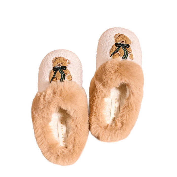 Cream teddy bear slippers with fuzzy camel fur trim and embroidered bear design with ribbon bow