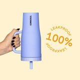 Hand holding a Corkcicle Cruiser tumbler by its handle with a 100% leakproof badge