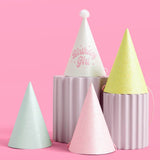 Pastel glitter birthday party hats set in white, pink, mint, and yellow with pom-poms