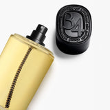 Diptyque 34 Boulevard Saint Germain Eau de Toilette bottle lying beside its black 34 cap