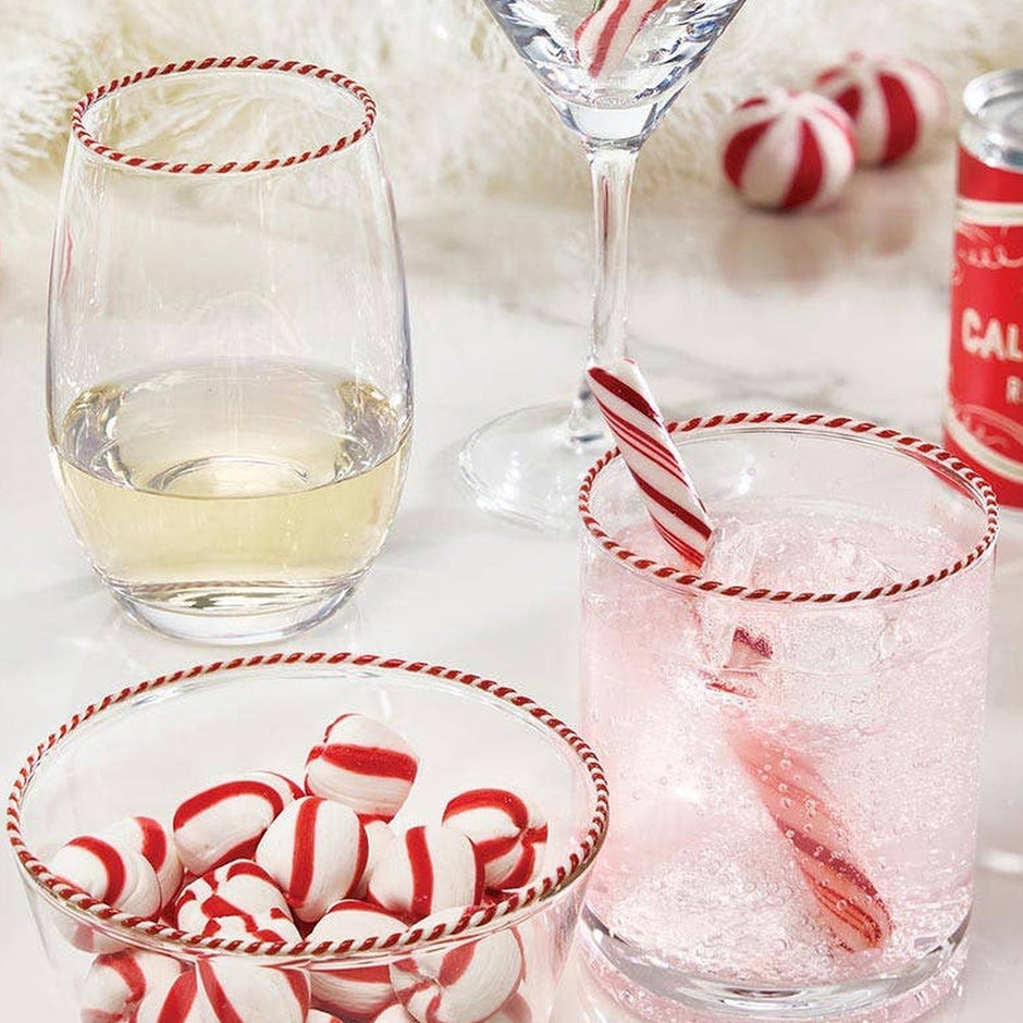 Peppermint Twist glasses with candy cane stirrers in festive holiday cocktail scene