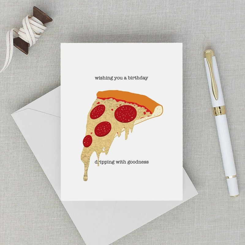 Cheesy Birthday pizza card with envelope and pen on neutral linen background