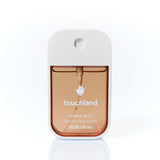 Touchland Power Mist hand sanitizer in Salted Caramel, 1 FL OZ bottle on white background