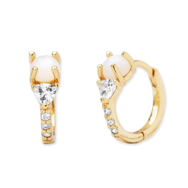 Gold hoop earrings with white opal stone and cubic zirconia accents on neutral background