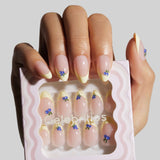 Nail art display with decorative nails and 'Celebrities' branding.