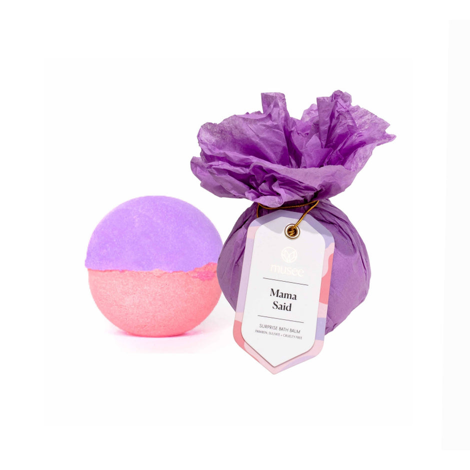 MUSEE Mama Said bath balm in purple and pink with tissue paper wrapping and label tag