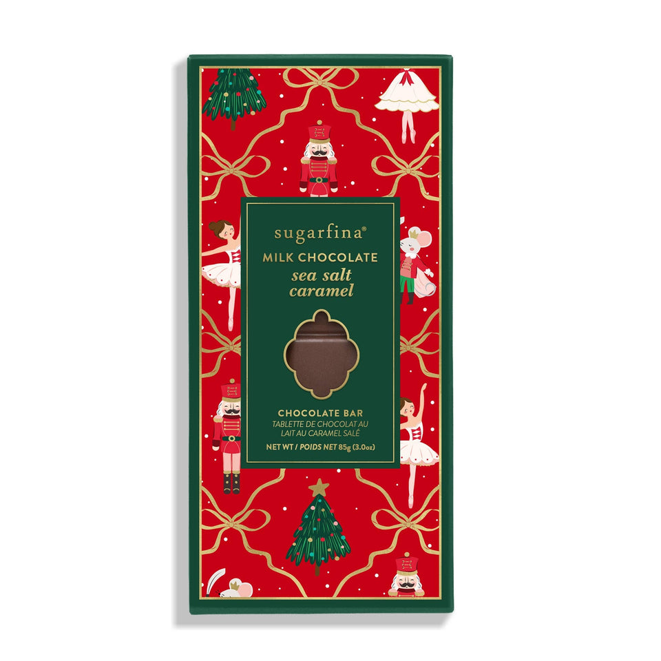 Sugarfina Milk Chocolate Sea Salt Caramel holiday chocolate bar with festive red and green packaging