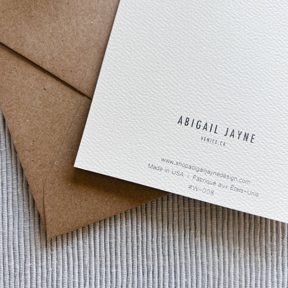 Abigail Jayne Design sympathy card with kraft envelope on textured neutral background