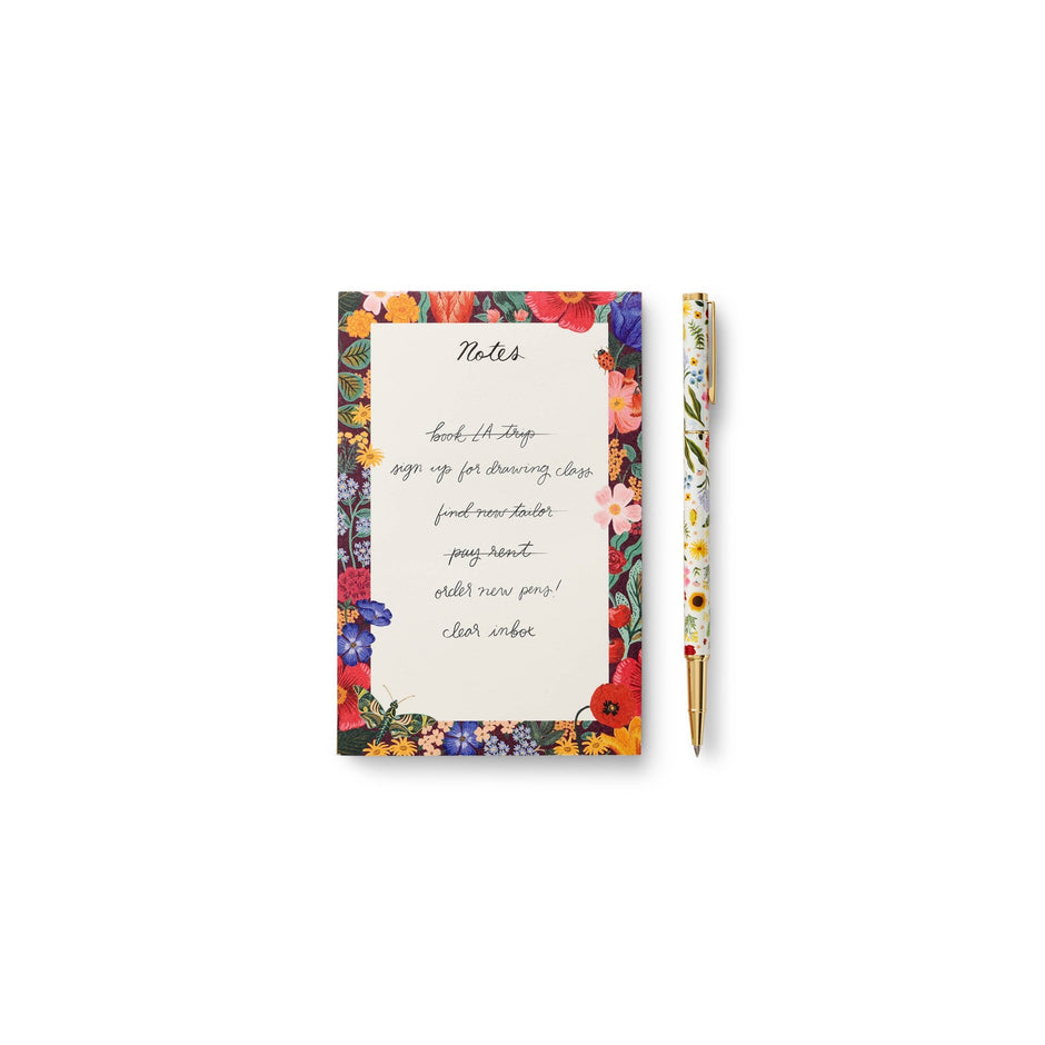 Rifle Paper Co. Curio Pen with floral notepad on white background