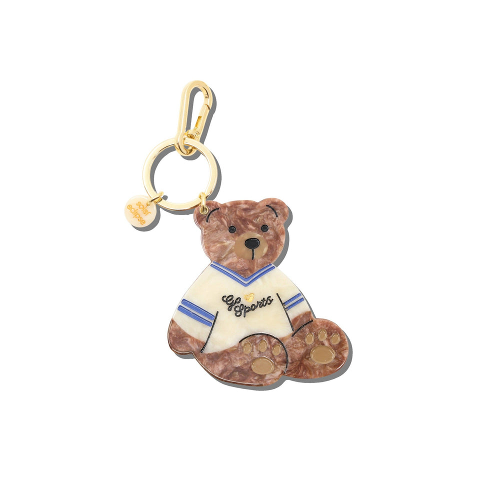 Hand-painted teddy bear bag charm with 'Go Sports' jersey design and gold keychain clip
