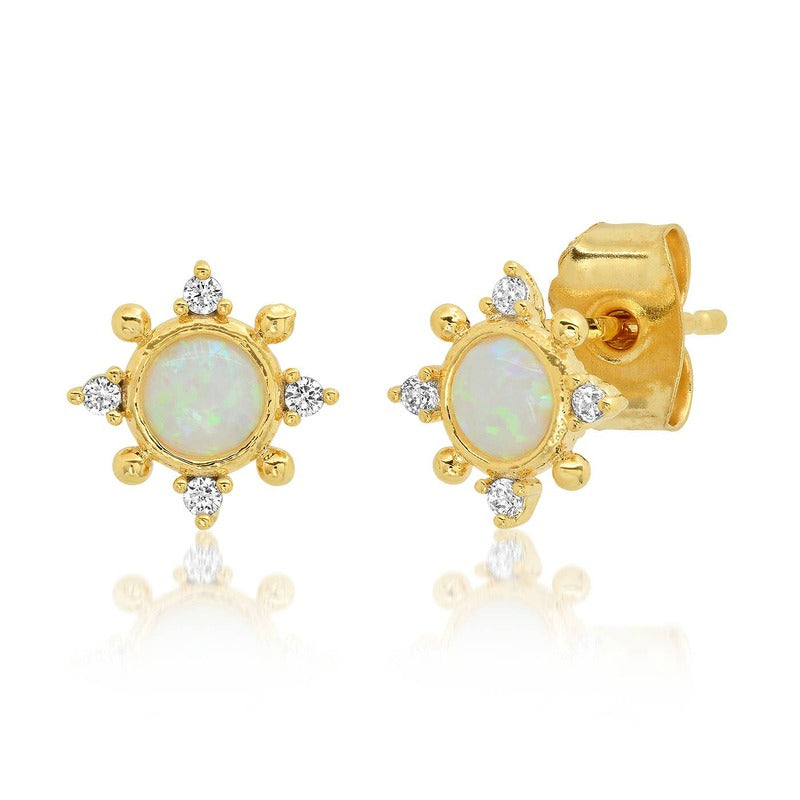 Gold opal medallion stud earrings with diamond accents on white background