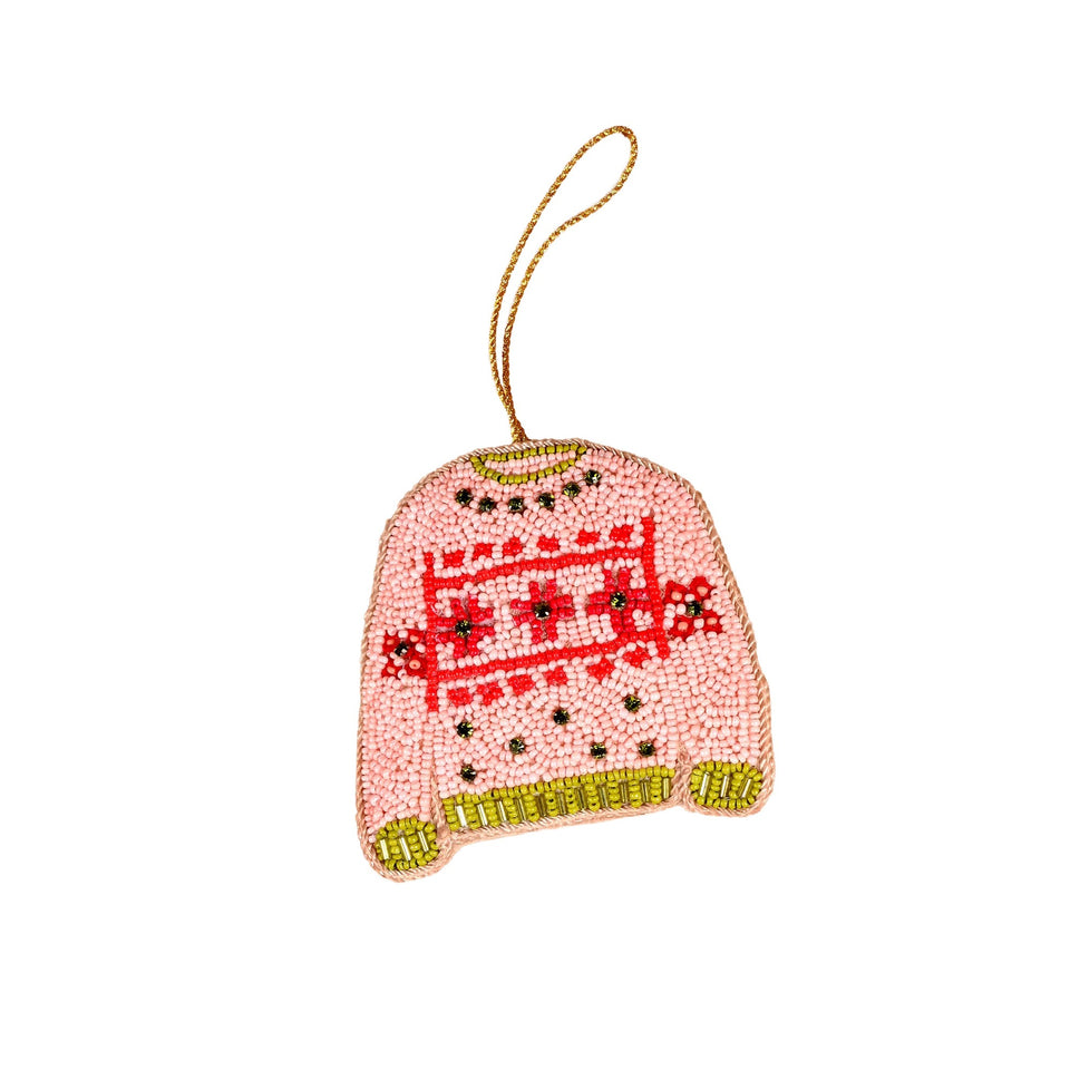 Pink beaded Christmas sweater ornament with red pattern and gold trim, hanging loop