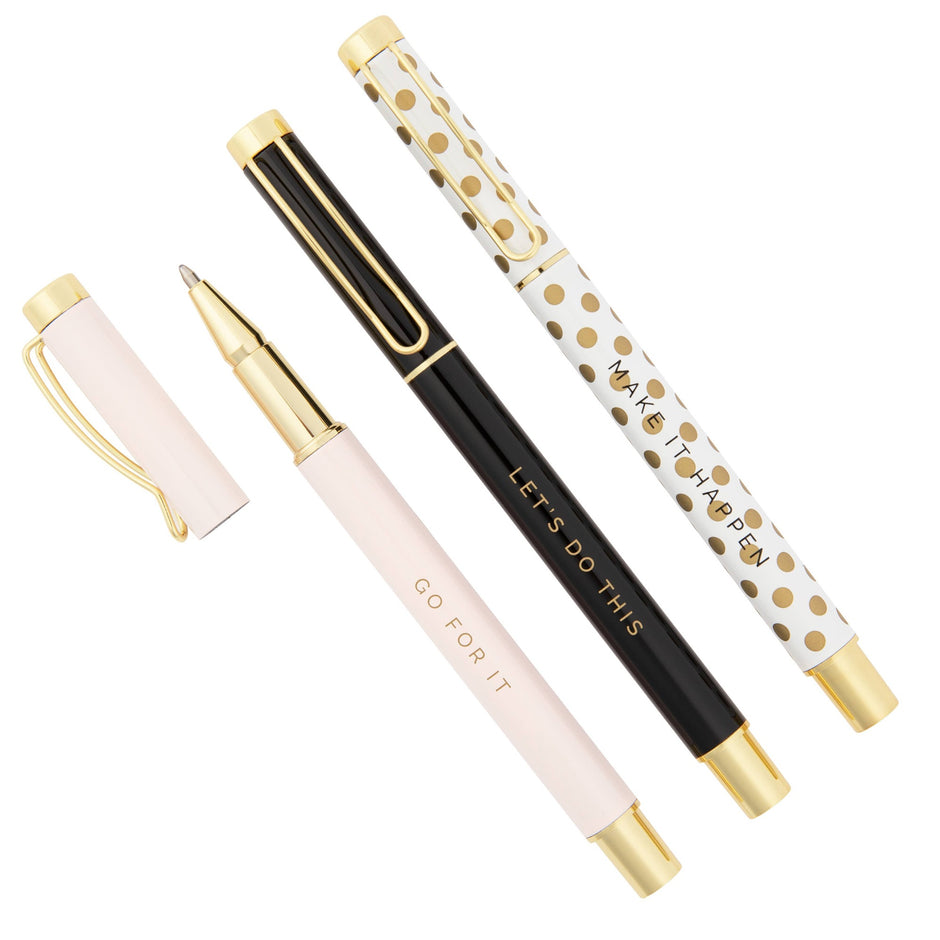 Set of four inspirational metal pens with gold accents in pink, cream, black, and polka dot designs