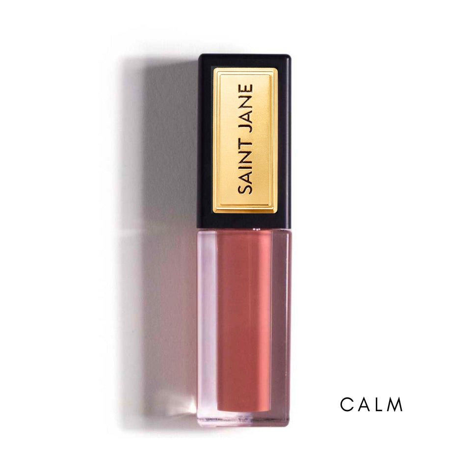Saint Jane Lip Shine in Calm shade - nude pink liquid lipstick with gold and black packaging