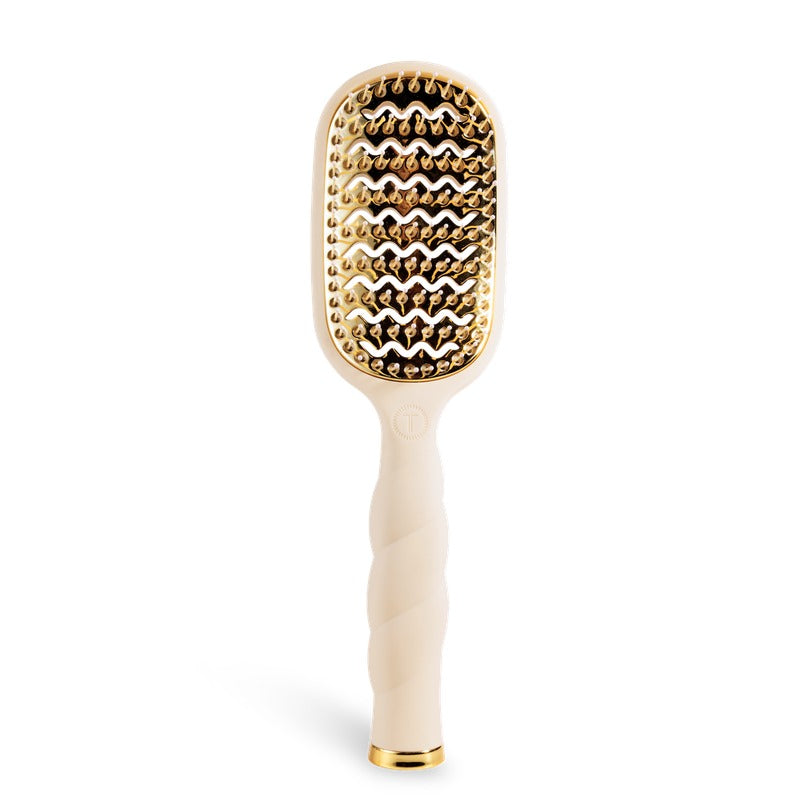 TELETIES Vented Hair Brush in tan with gold ionic bristles on black background