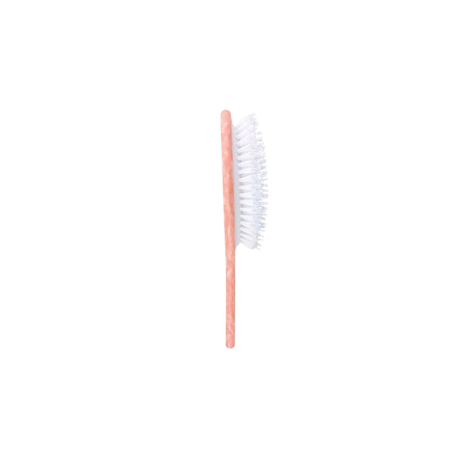 Pink hand-painted vintage ballet bow handbag hero brush with white bristles on neutral background
