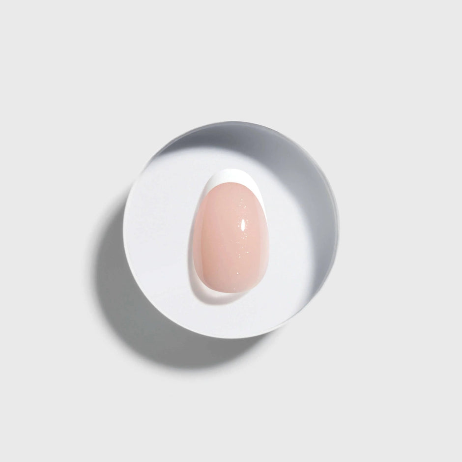 CELEBRITIPS Luminé Classic French Extra Short Round Press On Nails in nude pink on white background