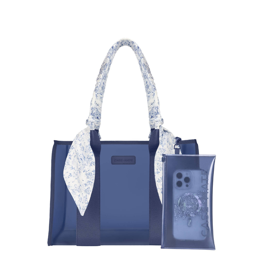 Navy blue Casemate tote bag with floral patterned handles and matching phone case attached