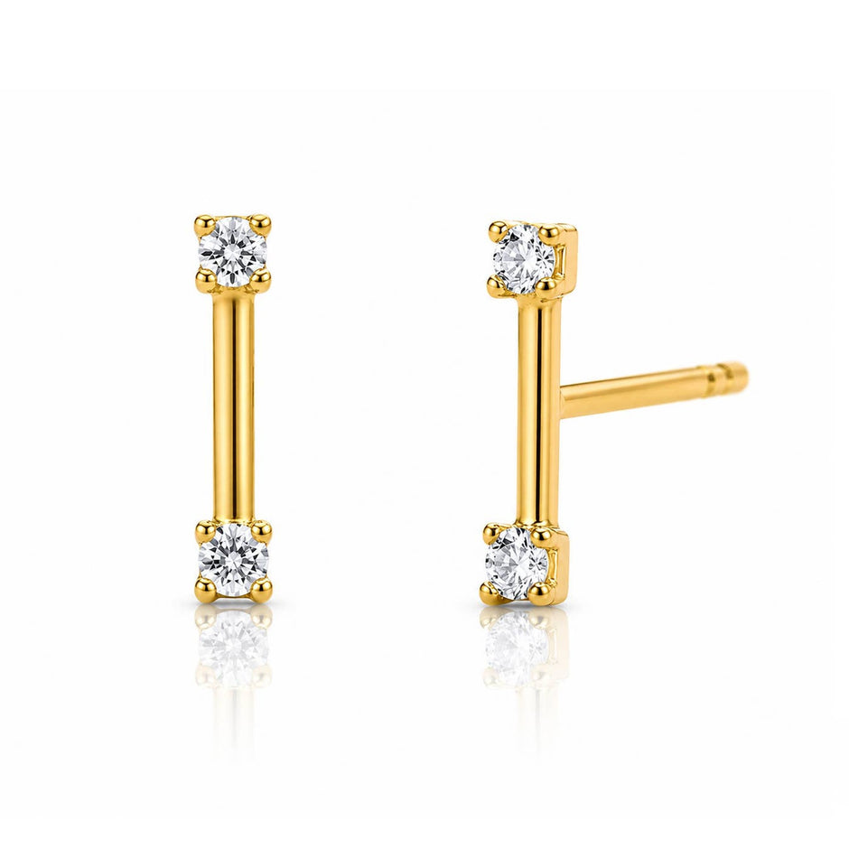 Gold stick post earrings with round diamond ends on white background