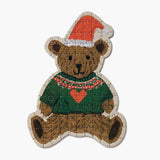 Beary Christmas Mini Jigsaw Puzzle featuring a teddy bear wearing a red Santa hat and green sweater