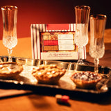 Pie Flight Mimosa kit on a tray with champagne flutes and mini pies