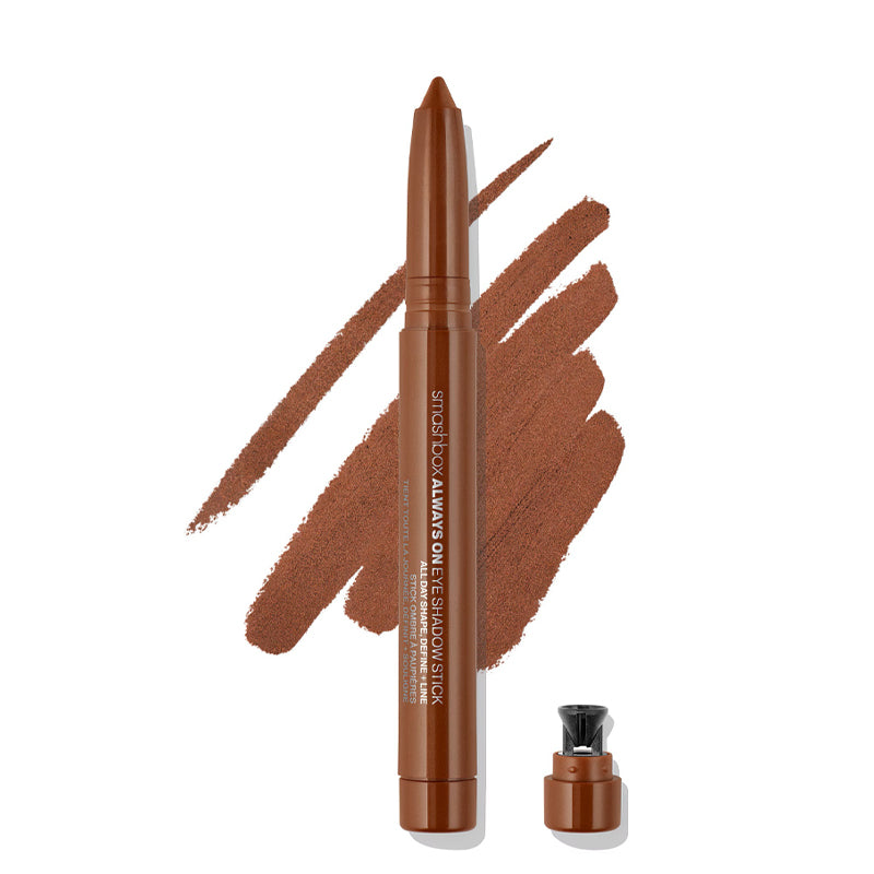 Brown makeup pencil with cap and color swatch on a white background