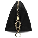 KUSSHI | Vacationer Makeup Bag — Black/Red, A black nylon zippered pouch with a prominent gold-tone metal zipper pull featuring a double-ring keychain attachment, shown on a plain white background.