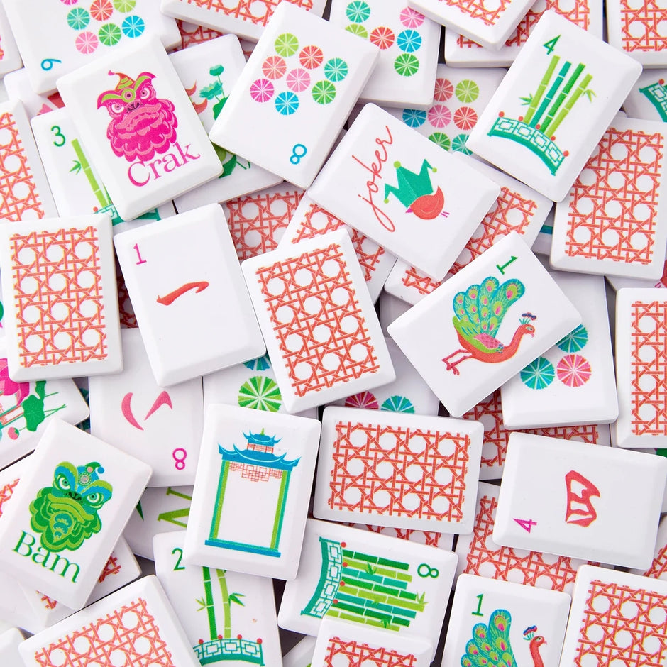 Colorful mahjong game tiles with various designs and text on a white background