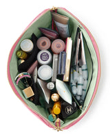 KUSSHI | Vacationer Makeup Bag — Sweet Pea/Pistachio, Open makeup bag with various cosmetic items on a white background
