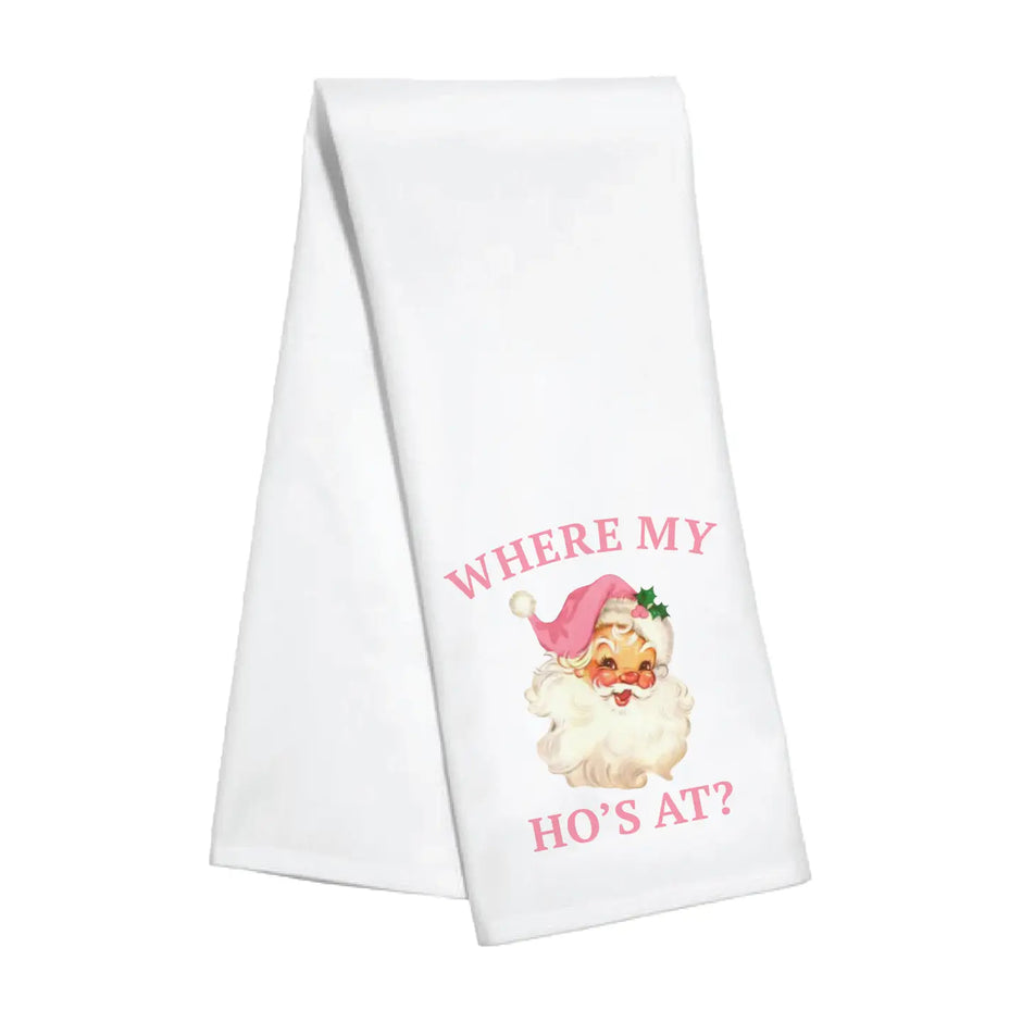 Tea towel with a vintage styled Santa Claus  wearing a pink santa hat. Pink lettering reads "Where My Ho's At?".