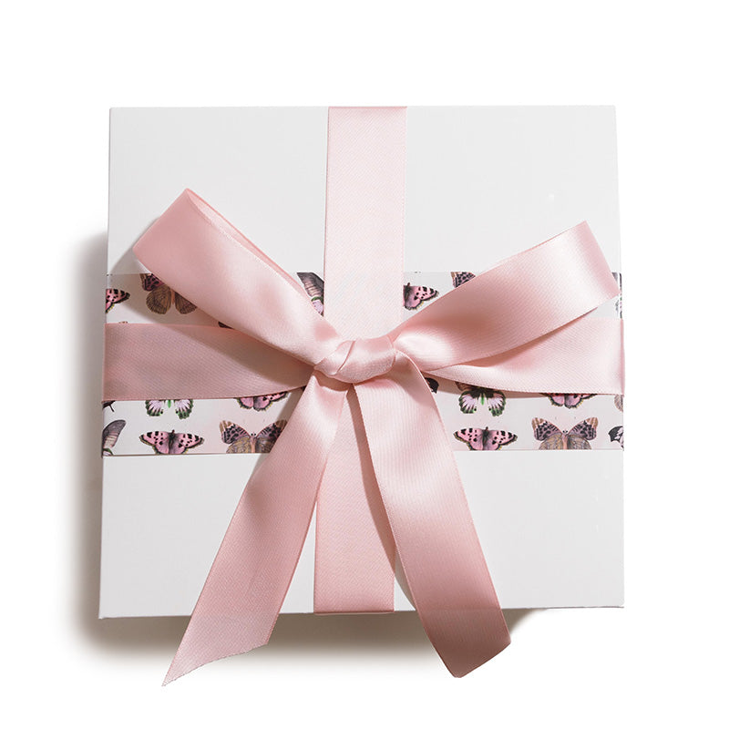 Pink moths of various types arranged in repeating rows on a pale beige background